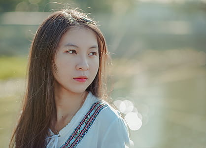 Shallow Focus Photography of Woman Wearing White Shirt thumbnail