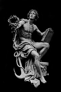 male statue with anchor and book thumbnail