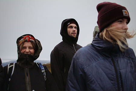 two women beside one man thumbnail