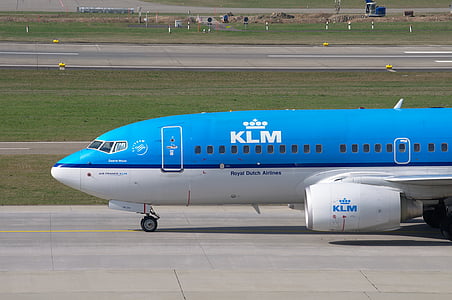 blue and white airline on airport thumbnail