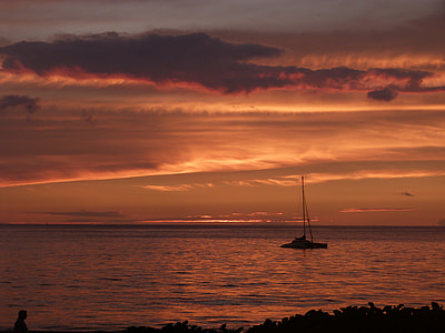 boat on sea during sunset thumbnail