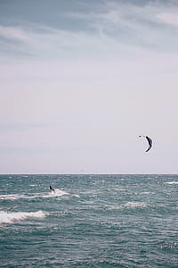 Surfboarding with surfing kite in the ocean thumbnail
