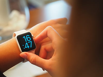 person holding digital watch reading 16:47 thumbnail
