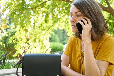 Woman Using Black Android Smartphone thumbnail