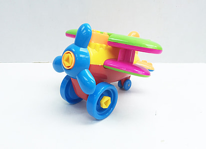 yellow, green, and blue monoplane toy thumbnail