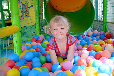 girl playing inside a ball pi thumbnail