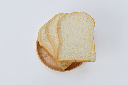 three sliced breads on round beige plate thumbnail