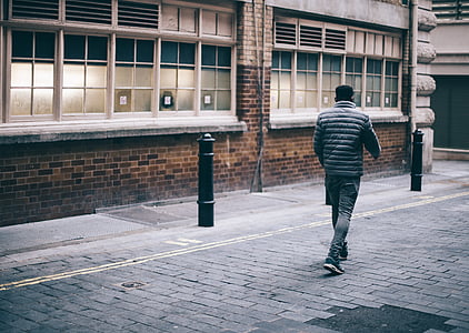 man walking on road thumbnail