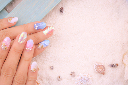 person's pink and blue nail arts thumbnail