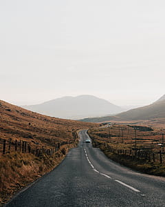 wide angle photo of gray road thumbnail