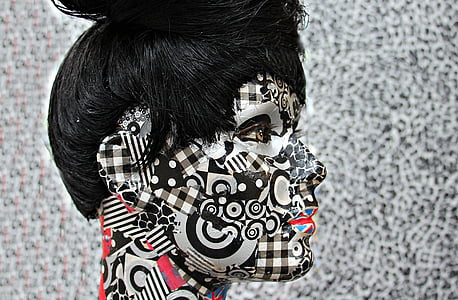 woman with black and white face painting thumbnail