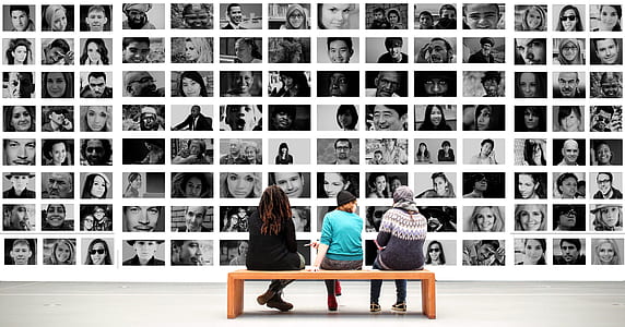three people sitting on bench in front of collage photos thumbnail