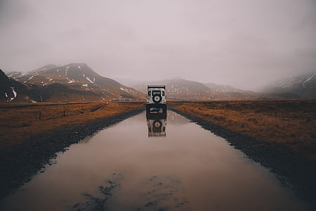 white vehicle on pathway thumbnail