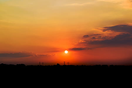 silhouette of building at sunset thumbnail