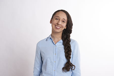 smiling woman wearing blue dress shirt thumbnail