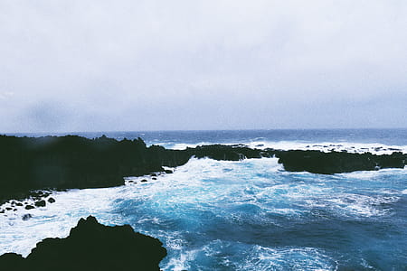 Photo Of Sea Under Cloudy Sky thumbnail