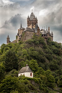 gray and brown castle on top of mountain thumbnail