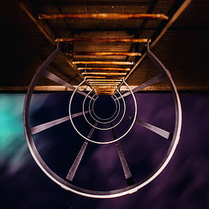 low angle photo of gray metal exit ladder with frame thumbnail