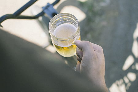 person holding clear glass mug thumbnail