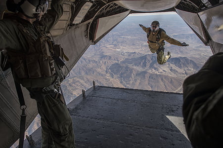 close-up photo of man standing inside plane during daytime thumbnail