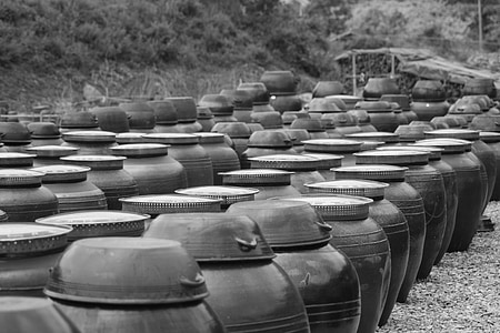grayscale photography of jars thumbnail