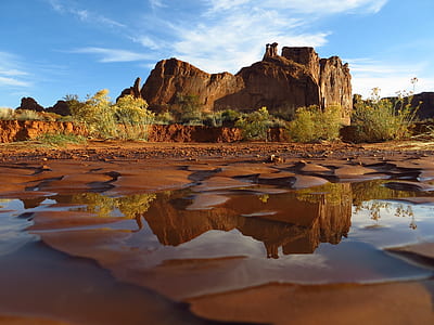 Body of Water in a Deserted Land With Green Grass during Daytime thumbnail
