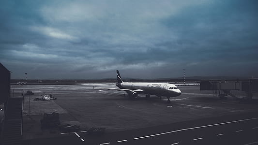 white airplane during nighttime thumbnail