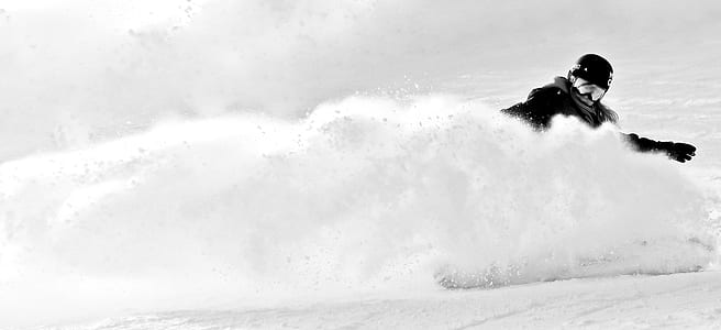 man in black suit skiing crashing through snow thumbnail