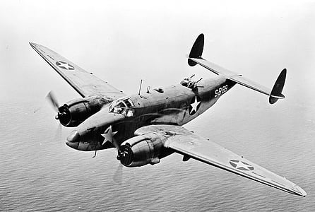 grayscale photography of SB-83 aircraft above large body of water thumbnail