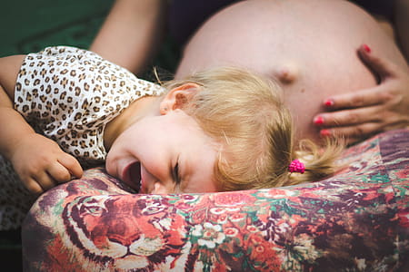 Girl Crying on Woman's Lap thumbnail