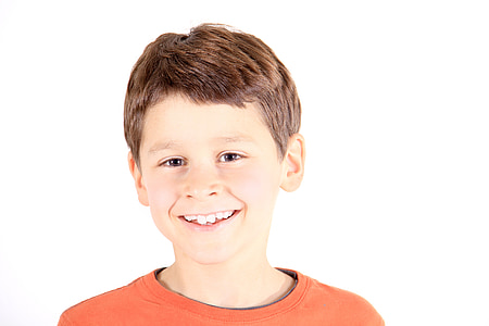 boy smiling wearing orange crew-neck top thumbnail