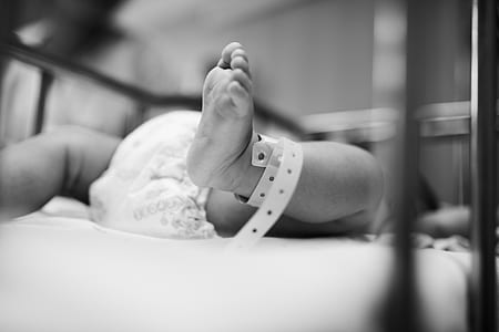 baby lying on bed thumbnail