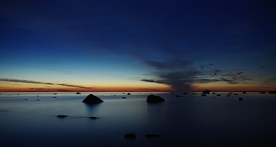 Body of Water Under Blue Skies during Golden Hour thumbnail