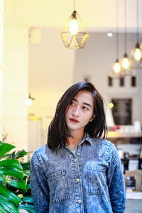 Woman in Blue Denim Button-up Jacket thumbnail