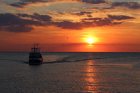 fishing vessel sails on sea thumbnail