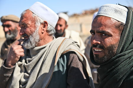 four group of men wearing taqiyah at daytime thumbnail