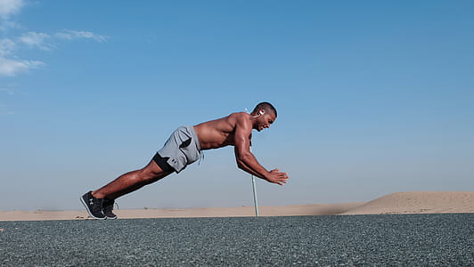 Man Doing Push Up Exercise Outdoors thumbnail