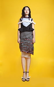 woman in black and gray dress thumbnail