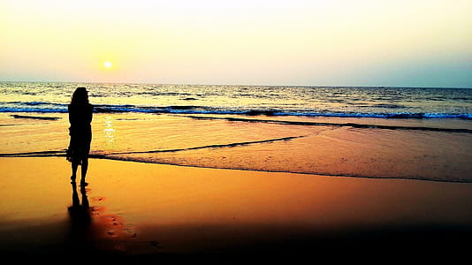 woman near beach during sunset thumbnail