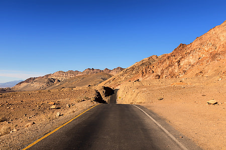 road beside mountain thumbnail
