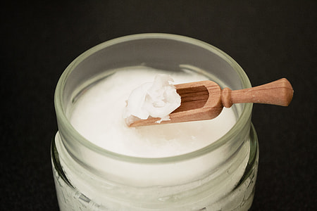Coconut Oil On Wooden Spoon thumbnail