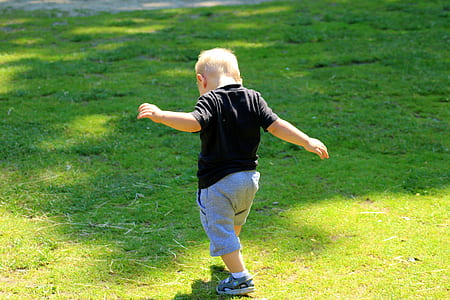 boy walking on lawn thumbnail