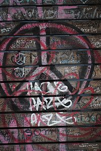 brown wall with graffiti close-up photography thumbnail