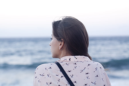 woman wearing white shirts front of sea during daytime thumbnail