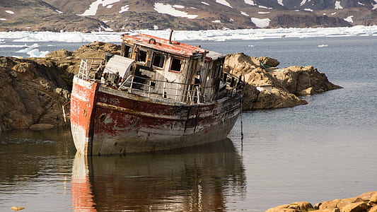 wrecked boat on body of water thumbnail