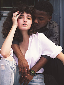 Man hugging Woman while taking a pose thumbnail
