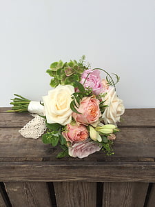 white, pink, and beige rose flower bouquet on brown surface thumbnail