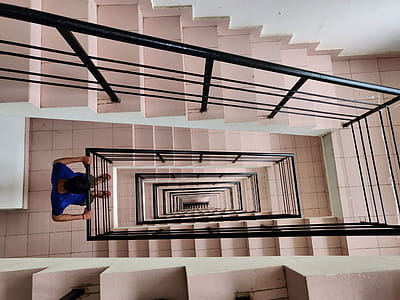 Man Looking Downwards of Stairs thumbnail