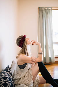 woman sitting on the floor near the window thumbnail