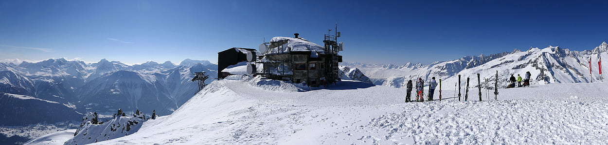 aerial photography of building near mountain at daytime thumbnail